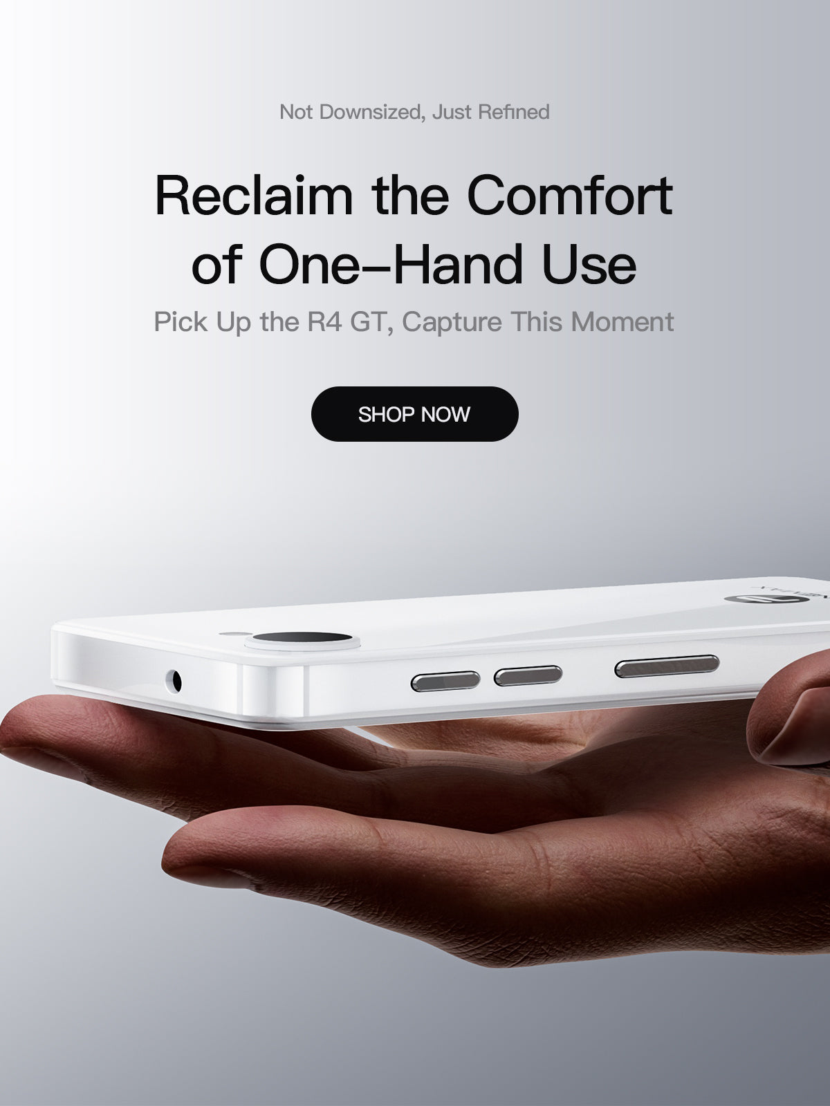 White Phonemax Q9 Mini balanced on a hand to show its slim body, ports and buttons