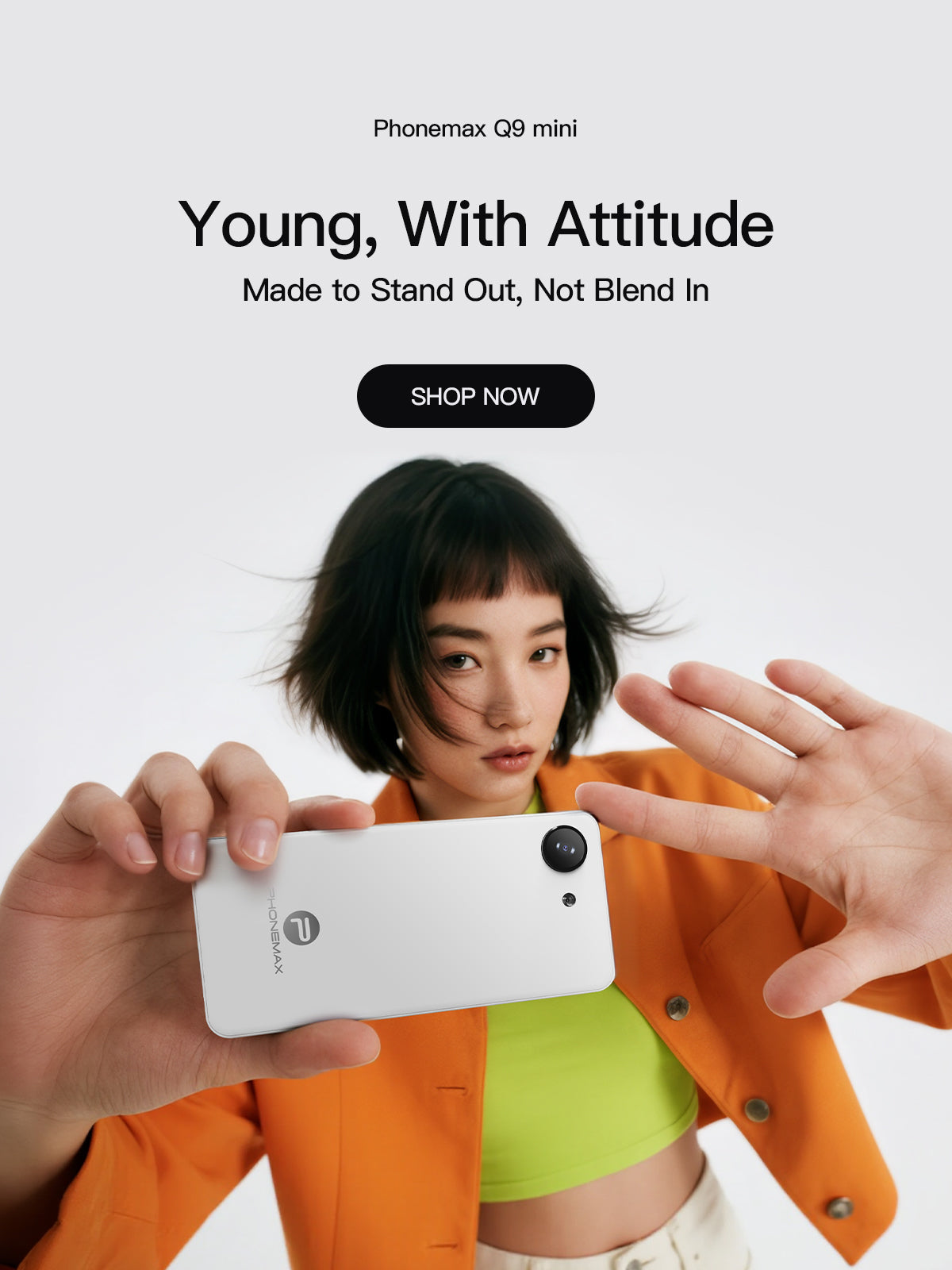 Woman framing a photo with a white Phonemax Q9 Mini compact smartphone