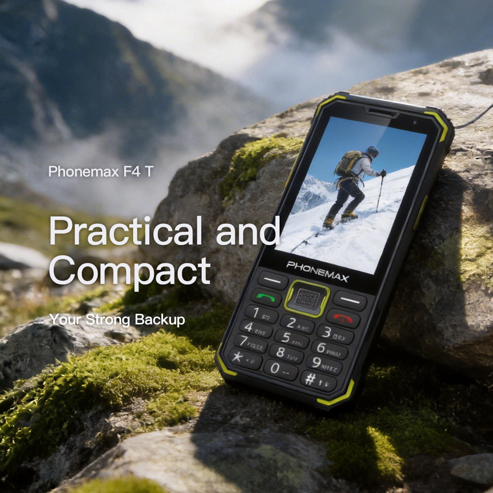 Phonemax F4 T rugged keypad phone resting on mountain rocks with a skiing photo on screen