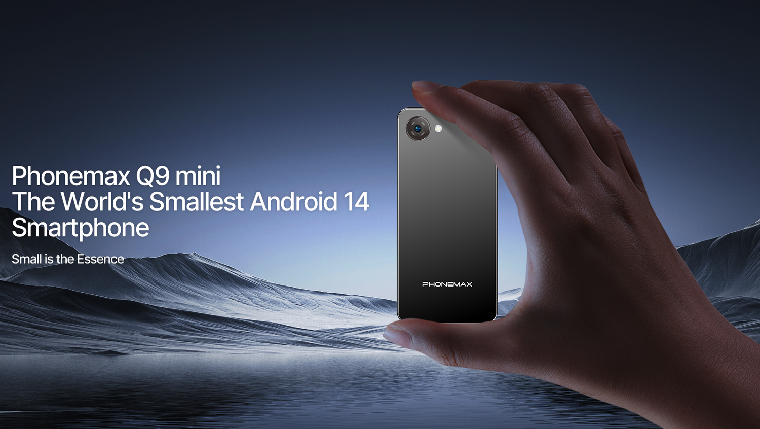 Phonemax Q9 Mini compact Android phone held between two fingers against a mountain background