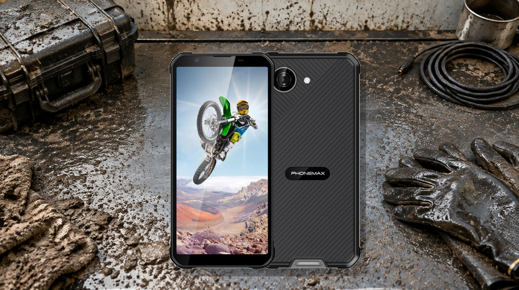 Phonemax X5 rugged phone on a muddy and dusty harsh-environment inspection bench